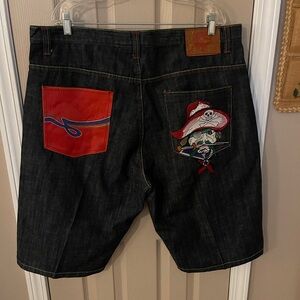 Ed Hardy 2008 dark wash men’s baggy denim jean shorts with embroidered pirate.